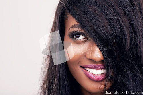 Image of Hair, beauty and face of black woman in studio for makeup, human extensions or cosmetics. Headshot of african female model smile on a white background thinking of salon mockup, skin glow or skincare