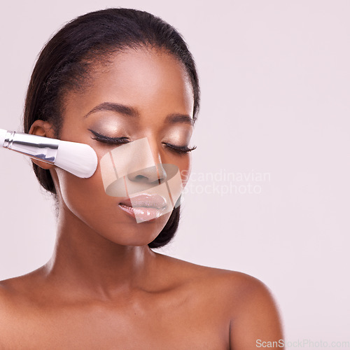 Image of Cosmetics, makeup brush and black woman with mockup in studio with foundation tool. Skincare, blush and cosmetic facial skin care, African beauty model with luxury product on pink background.