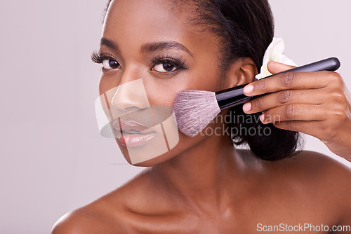 Image of Portrait, makeup and black woman with brush in studio, cosmetic application tool and glamour. Skincare, blush and cosmetics, beauty model in luxury contour powder product on on cheek pink background.