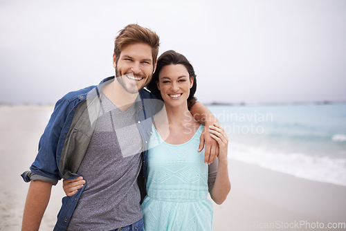 Image of Portrait, couple and hug at beach for travel, romance and freedom while walking together outdoors. Love, face and happy woman embracing man on trip, vacation or holiday, bond or having fun in Florida