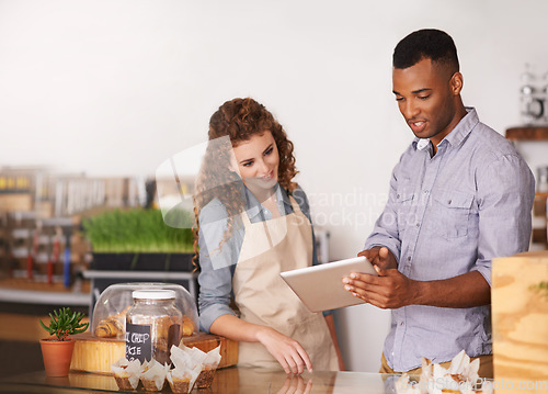 Image of Tablet, coffee shop owner and teamwork of people, discussion and training. Waiters, black man and happy woman in restaurant with technology for inventory, stock check or managing sales in store.