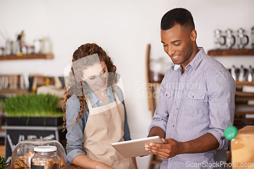 Image of Cafe owner, tablet and teamwork of people, discussion and training in coffee shop. Waiters, black man and happy woman in restaurant with technology for inventory, stock check and managing sales.