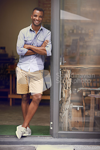 Image of Black man, coffee shop and portrait of small business owner at front door with a smile. Entrepreneur african person as manager in a restaurant for hospitality service, career pride and startup goals