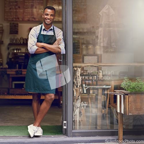 Image of Smile, coffee shop and portrait of a man as small business owner at front door. Happy entrepreneur person as barista, manager or waiter in restaurant for service, career pride and startup goal