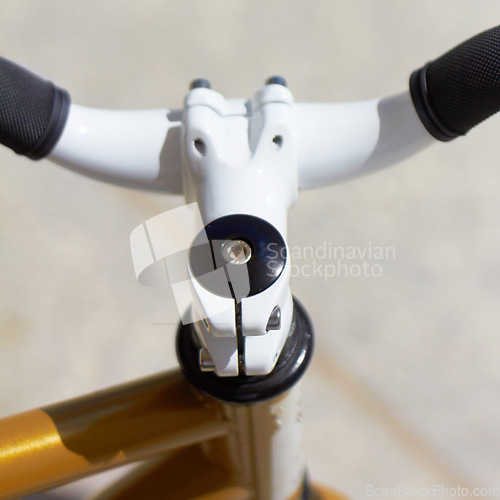 Image of Fitness, sports and handle with a closeup of a bike outdoor from above for a cycle or ride for cardio training. Exercise, health and a bicycle outdoor for an endurance workout or cycling marathon