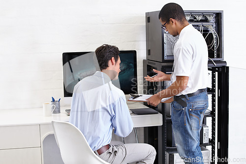 Image of Server room, man or technician with clipboard talking to a client about cyber security glitch or hardware. Network, database or contract with a male engineer speaking of information technology help