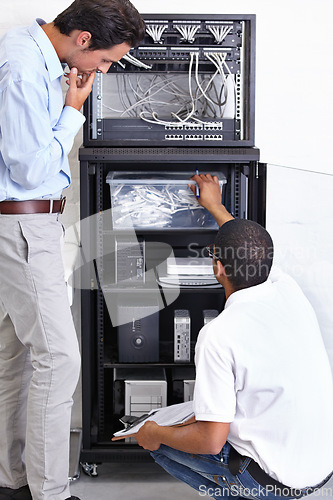 Image of Information technology, men and clipboard in server room for fixing, inspection and maintenance. Checklist, IT technician and computer in data center for cybersecurity, networking or database repair.