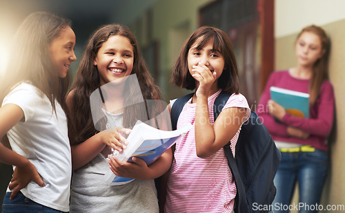 Image of Girl, school and bullying angry kid is sad by problem with students at school building. Young, teenager and notebook gossip about kid on wall studying in class for an education is depressed.