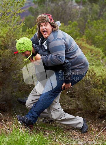 Image of Piggy back, fun and man friends outdoor camping in nature playing and having fun together. Happy, smile and silly portrait of youth and men laughing in the forest on summer camp holiday by trees