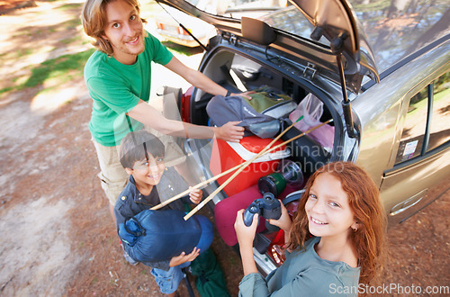 Image of Happy family, portrait and packing car for road trip, holiday or camping vacation together in nature. Top view of father and children with smile for summer camp adventure, weekend or travel in forest