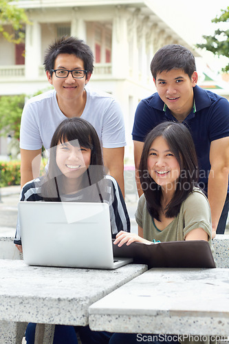 Image of Smile, portrait and students with a laptop for education, studying and college research. Happy, Asian and men and women with a computer and notes for university work, learning and a group project