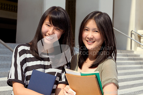 Image of College, happy and portrait of girl friends with scholarship standing outdoor on campus for education. Knowledge, smile and Japanese female university students by a school building in the city.