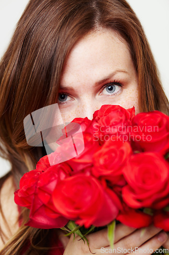 Image of Roses, flowers and portrait of woman with red gift for love, celebrate and a valentines day floral present or glamour. Aesthetic, skincare and eyes of female person or model with plants or a bouquet