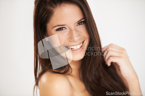 Image of Portrait, beauty and smile with a model woman in studio on a white background for natural skincare. Face, happy and cosmetics with an attractive young female person posing for luxury skin treatment