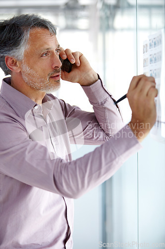 Image of Senior business man, phone call and writing on glass board, ideas and agenda, brainstorming for ad campaign. Communication, problem solving and networking, male employee plan at advertising startup