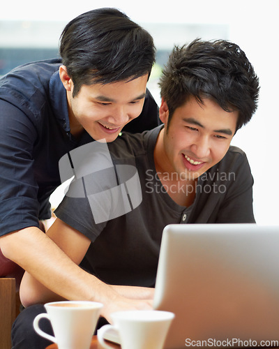 Image of Happy, email and a gay couple with a laptop for a movie, internet search or reading web research. Smile, love and Asian men with a computer for online information, movie choice or show together