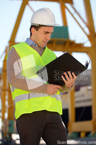 Image of Documents, construction site and man for inspection, reading building information or compliance folder outdoor. Engineering, architecture and person with industry checklist of project management