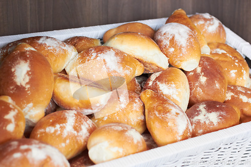 Image of Flour bread, food and bakery basket of rolls from cooking, catering service, breakfast or baking meal at cafe. Bunch of fresh baked or crispy roll snack for eating, nutrition or fiber in restaurant