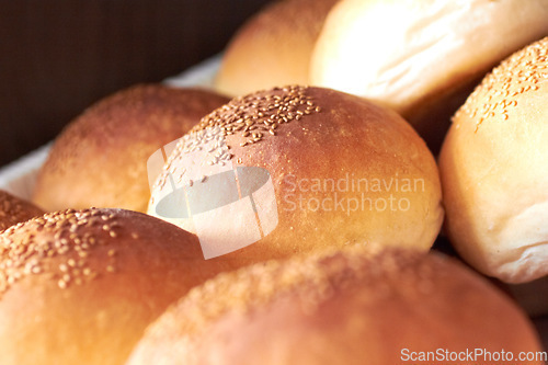 Image of Sesame bread, food and bakery basket of rolls from cooking, catering service, breakfast or baking meal at cafe. Closeup of fresh baked, buns or roll snack for eating, nutrition or fiber in restaurant