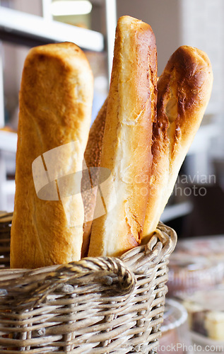 Image of Wheat bakery with bread basket in a supermarket or grocery store for a diet or healthy food with nutrition. Morning, kitchen and oven baked fresh roll or product for lunch or breakfast in a shop