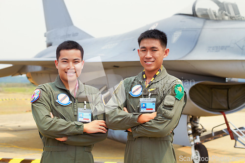 Image of Portrait of men, fighter pilot team in military with jet and smile at airforce base with arms crossed in Korea. Freedom, transport and proud Asian soldier with airplane, confident and service in army