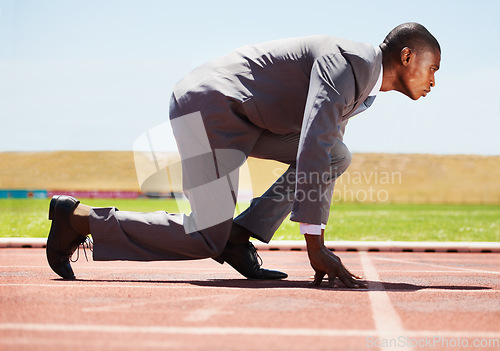 Image of Business, start and black man with focus, race track and competition with determination, run and goal. Male person, entrepreneur or employee in a suit, marathon and runner with a challenge and career