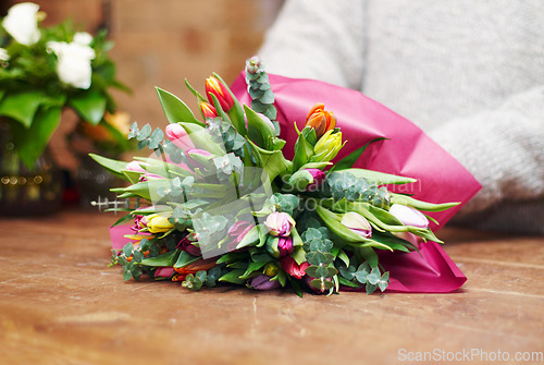 Image of Closeup, bouquet and florist with startup, flowers and prepare gift for a customer, client and growth. Zoom, female person and entrepreneur with plants, present and floral arrangement with employee