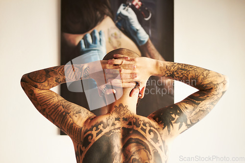 Image of Man, tattoo and back or art with body with creativity or unique or shirtless at house. Tattoos, male person and backwards with ink with hands on head with skin for aesthetic or creative or edgy.