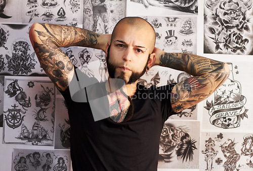 Image of Portrait, tattoo and man with creativity, artist and business with skills, wallpaper and design. Face, male person and guy with creative, ink and career with body art, trendy and edgy with culture