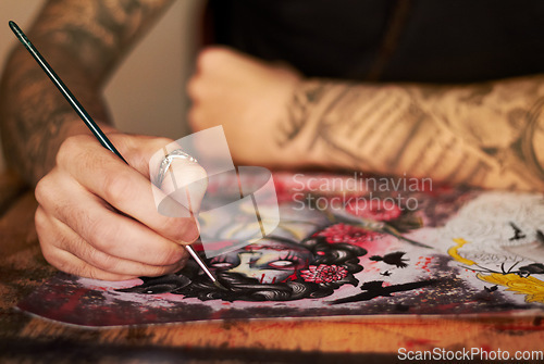 Image of Art, paint and creative with a woman tattoo artist closeup in a studio to design a piece of artwork. Hand, canvas and a female painter using color ink while painting a picture closeup for expression