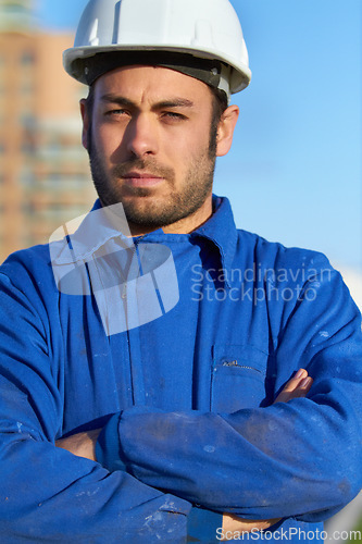 Image of Man, architect and portrait of confident contractor with arms crossed for building construction in city. Serious male person, engineer or builder with hard hat for industrial architecture in town