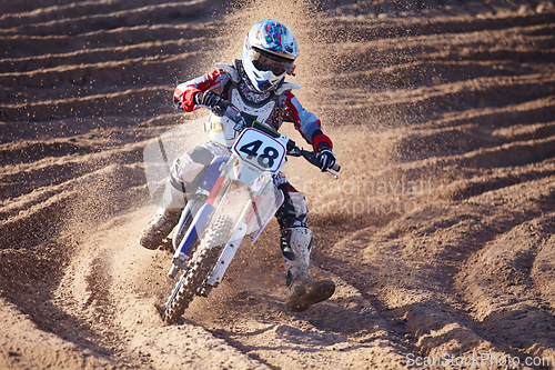 Image of Competition, dirt and bike with speed and power in desert for sports or challenge. Motorbike, action and trail with sand for race with sport or freedom in sand for adventure in outdoor with travel.