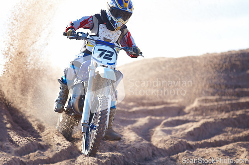 Image of Competition, sand and motorbike for sports with action for challenge on course with power. Speed, performance and desert with bike for race or adventure in outdoor with freedom or fearless driving