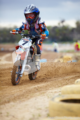 Image of Sports, dirt road and athlete riding a motorcycle with speed for a race or sport competition. Challenge, fitness and man biker on motorbike for adrenaline, training or practicing on outdoor mud trail