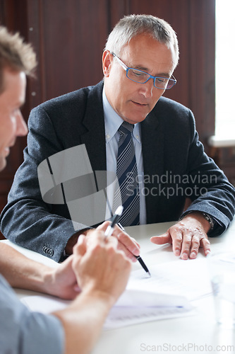 Image of Planning, businessmen with paperwork and in a business meeting together in a boardroom. Finance support or consulting, collaboration or teamwork and colleagues discussing in a modern workplace office