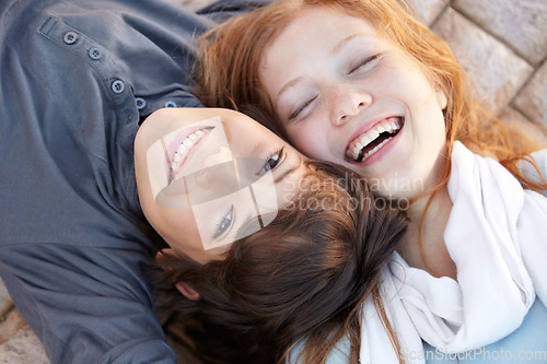 Image of Portrait, laughing and above of friends in nature for love, bonding and happiness. Smile, care and a boy, girl or sibling children on the ground together for a funny joke, friendship or playful