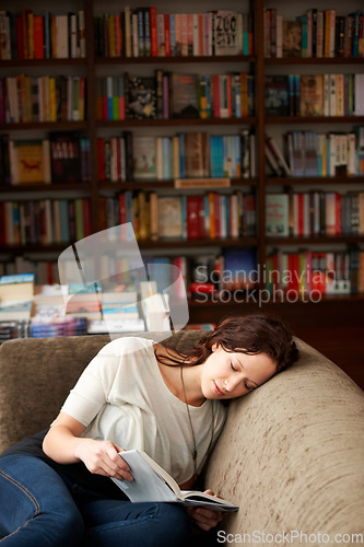 Image of Relax, literature and woman reading a story for knowledge while sitting on a sofa in library. Calm, happy and female person with a smile enjoying a fantasy book or novel on couch in bookstore or shop