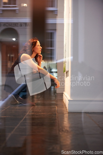 Image of Museum, exhibition and a woman thinking in an art gallery, looking at a painting or photography in creative appreciation. Artistic, design or culture with an attractive young female at an exhibit