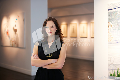 Image of Pride, arms crossed and portrait of a woman at an art gallery for an exhibition. Creative, culture and a museum manager with management of paintings, collection and curator of pictures at a studio