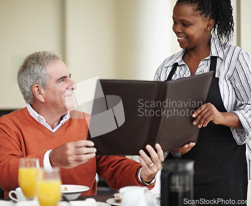 Image of Waitress, menu and senior man in a restaurant for breakfast or lunch at a hotel with service and choice of food. Friendly, order and elderly person happy on vacation or holiday for hospitality