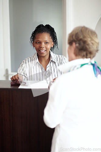 Image of Hotel receptionist, hospitality and a black woman helping a senior tourist to check in at a luxury resort. Concierge, travel or holiday getaway with a happy female secretary in a lodge for assistance