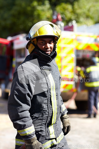 Image of Safety, hero and portrait of a black man as a firefighter for service, fire emergency and working. Job, professional and an African fireman in a uniform for security, rescue and fearless career