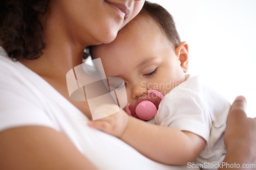 Image of Baby, face and girl sleeping with mom holding newborn or mother with child, pacifier and morning rest together. Calm, infant and peace in sleep with mommy, love or cuddle in bedroom with kid