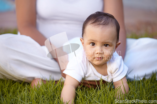 Image of Portrait, crawling and baby with a mother in the park together during summer for bonding, care and playing. Kids, face and a curious infant child with mama on grass, garden and in nature outdoor