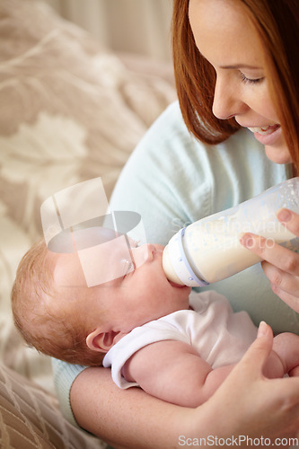 Image of Mother, baby and feeding milk from bottle for nutrition, healthy breakfast and diet in the morning. Mom, child and feed newborn formula food for growth, development and wellness in happy home bedroom