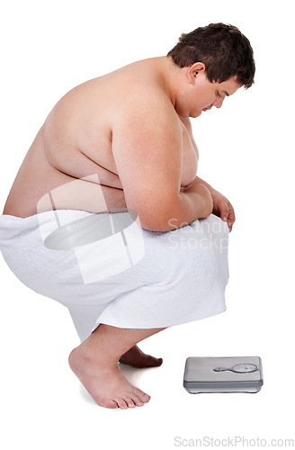 Image of Scale, plus size and man checking number and weight loss progress in a studio. White background, male person and profile of a heavy set model looking at health and wellness results with a towel