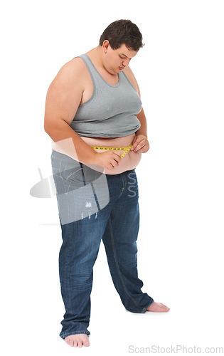 Image of Obesity, measuring tape on abdomen and man checking diet, stomach size and body health isolated on white background. Healthcare, measure stomach for weight loss progress and male on studio backdrop.