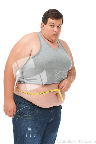 Image of Obesity, measuring tape on waist and portrait man checking diet, size and body health isolated on white background. Real male, surprise and measure stomach for weight loss progress on studio backdrop