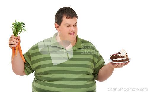 Image of Plus size, hungry decision and man with carrot and dessert choice thinking about food. Male model, studio and white background with healthy and cake order with weight loss and nutrition balance idea