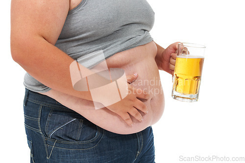 Image of Beer, weight gain and plus size stomach in a studio with alcohol problem with gut health issue. Heavy, overweight and drinking carbs with unhealthy body and alcoholic drink with high calories